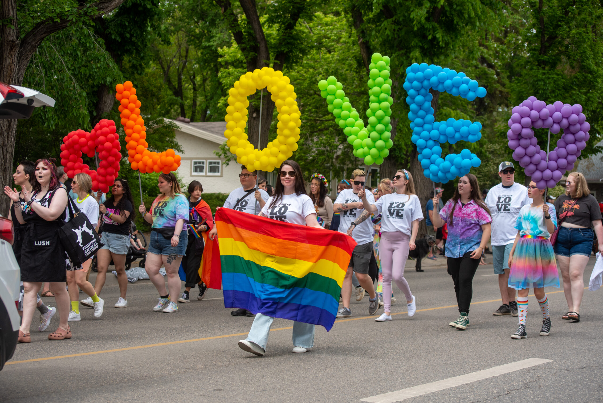 Picture of balloons spelling out love in pride colours. 